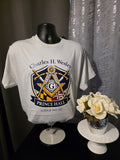 White t-shirt with Prince Hall Masonic design on a mannequin against a dark background.